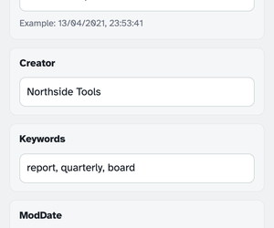 The middle of the editor: Creator “Northside Tools”, Keywords “report, quarterly, board” and the ModDate box with its example hint
